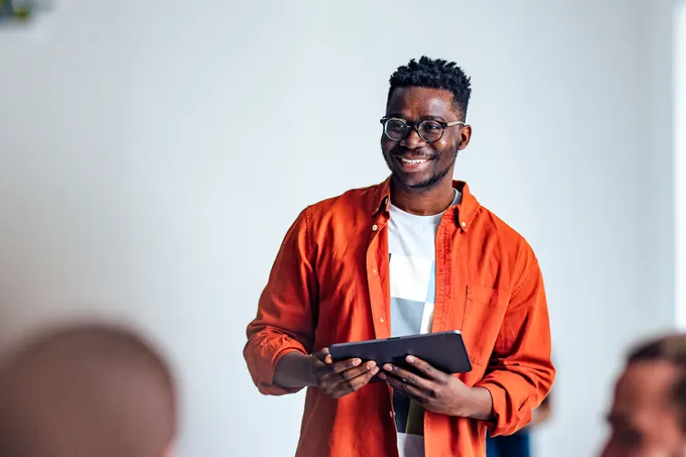 An instructor speaking in front of an audience
